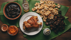 Filipino food spread with crispy pata, dinuguan, and aligue showing high blood pressure risk dishes