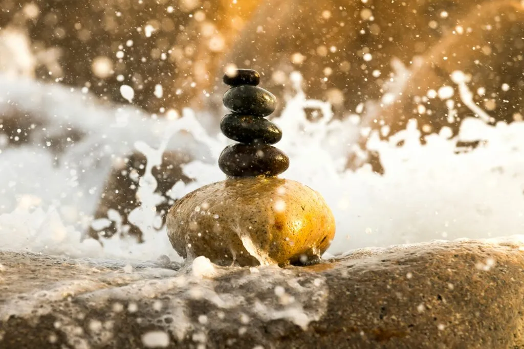 pexels-photo-2171464-2171464 Peaceful balance of stacked stones amidst splashing water, creating a zen-like ambiance.